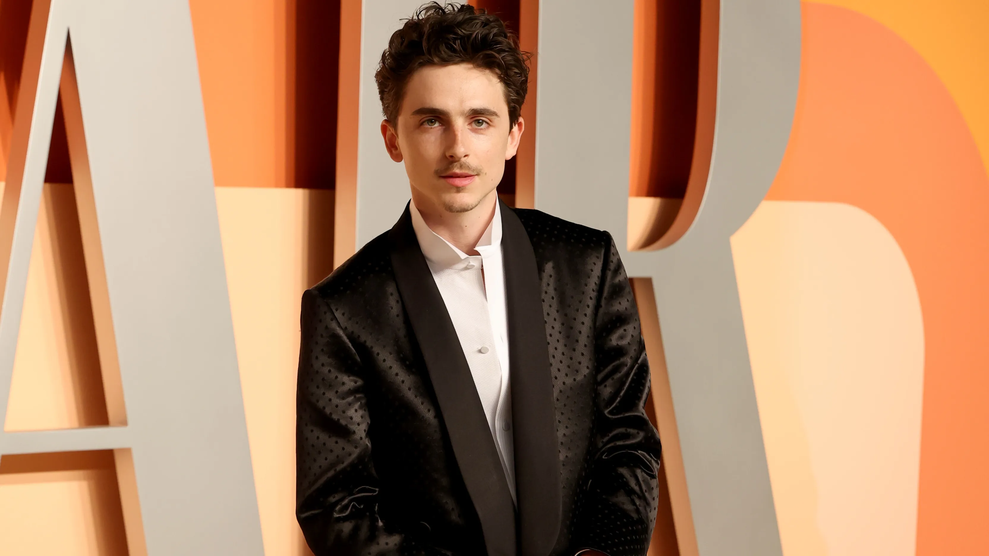 Timothée Chalamet in a transparent Haider Ackermann ensemble at the 2025 Vanity Fair Oscar Party
